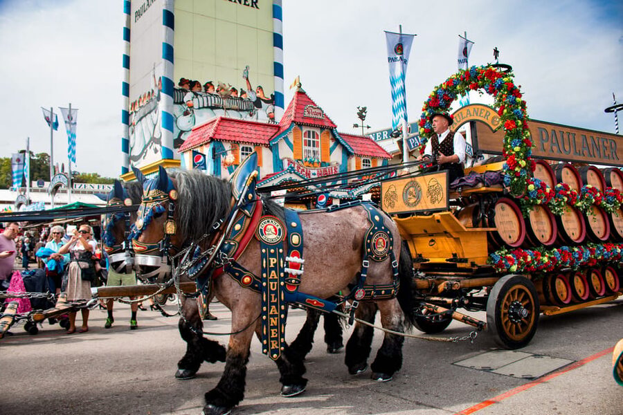 Munich: Oktoberfest Tour with Tent Reservation, Food & Beer - Entering a large beer tent with food and beer included